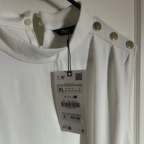 White romper with gold buttons on shoulder. - Picture 2 of 3